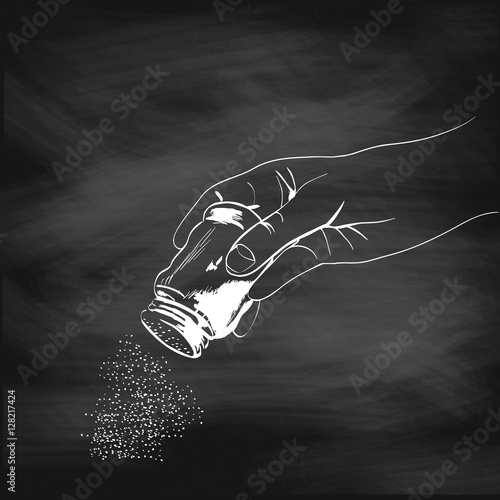 Illustration of a hand with the salt shaker painted chalk on a blackboard