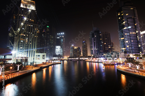 Architecture theme. Dubai marina. Luxurious travel and living  business and finance theme. Luxurious apartments. High value property. Night lights. Illuminated skyline. Big construction site.