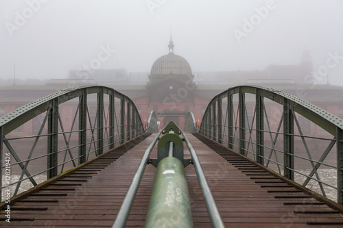 Historic fish market of Hamburg during a cold foggy winter day photo