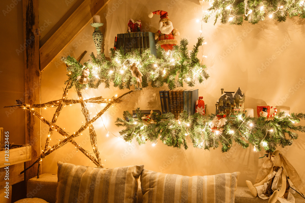 Obraz premium Calm image of interior modern home living room decorated christmas tree and gifts, sofa, table covered with blanket.