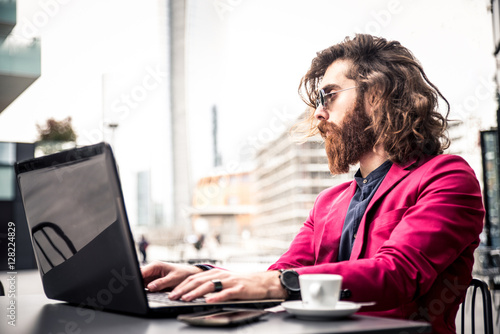 Hipster man working at computer