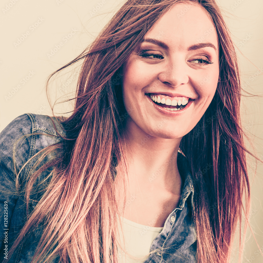 Fototapeta premium Young woman with waving hairs.