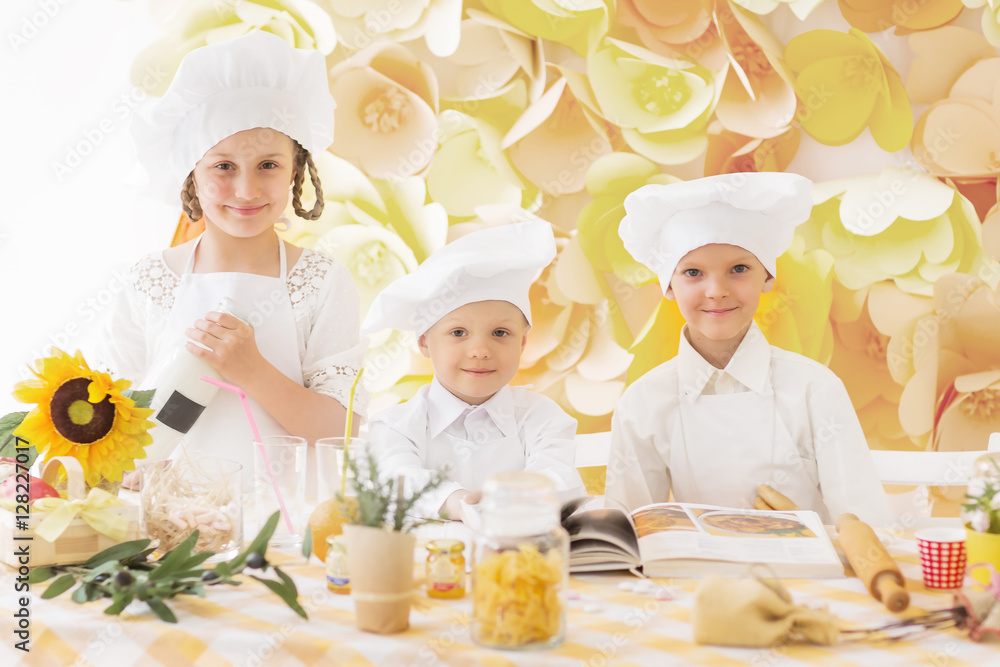 happy little children in the form of a chef to prepare delicious happy little children in the form of a chef to prepare delicious