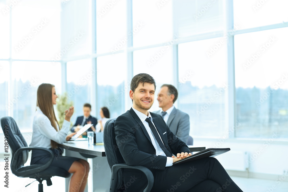 portrait of a successful businessman in the office on the background portrait of a successful businessman in the office on the background