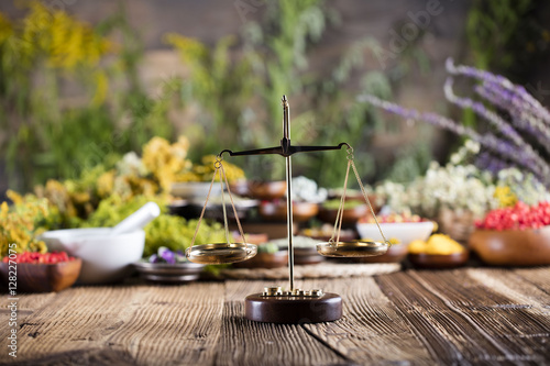 Assorted natural medical herbs and mortar