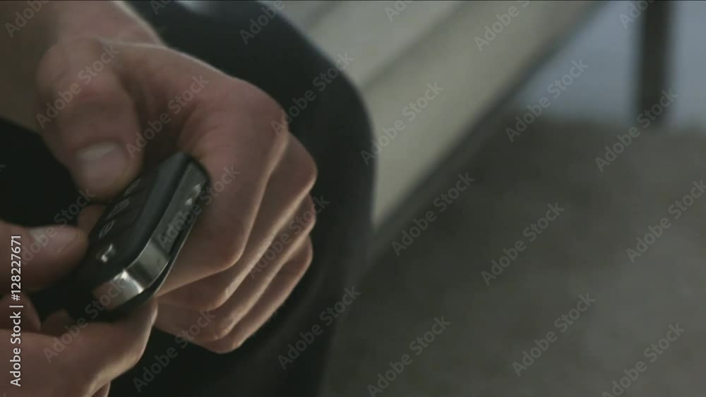 Man Unlocking and Locking Car Keys Man Unlocking and Locking Car Keys