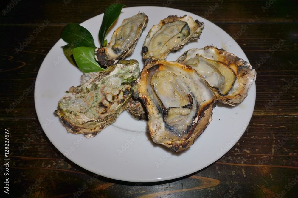 Grilled oysters, the food specialty of Miyajima, Japan Grilled oysters, the food specialty of Miyajima, Japan