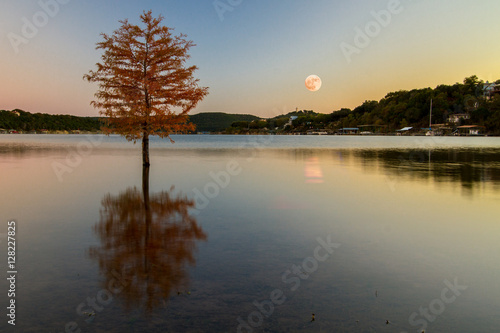 Supermoon in November 2016 reflection off Sandy Creek Arm of Lake Travis viewed from Jones Brother's Park in Jonestown, Texas, USA.