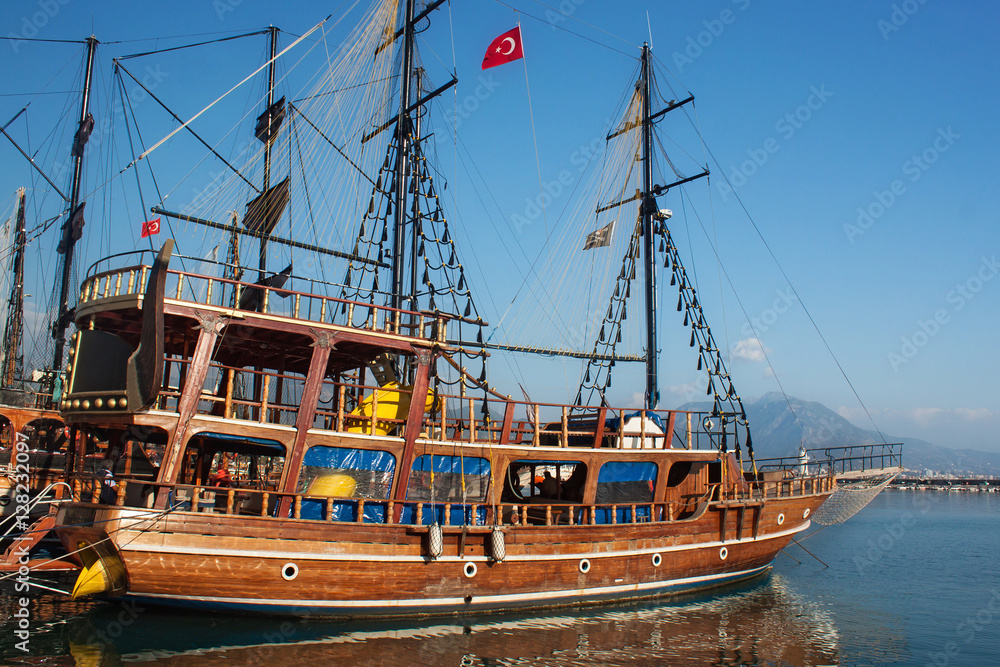 Small wooden pirate sailing ship for marine tourist trips along the coast of Alanya. Boat tours is a very popular form of recreation in the Mediterranean.