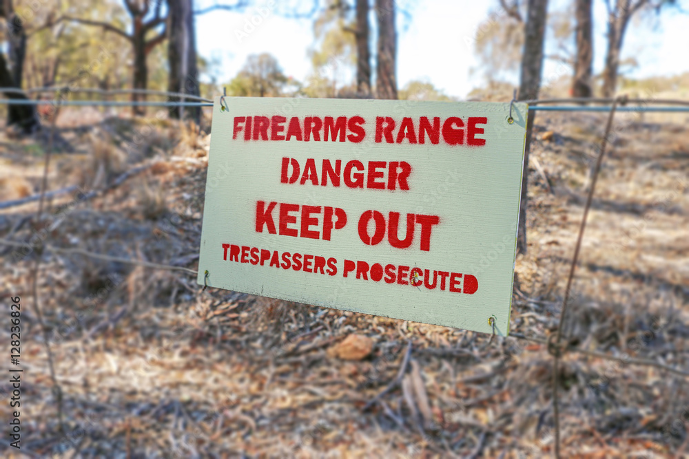 Danger, Firearms Range, Keep Out, Trespassers Prosecuted sign on