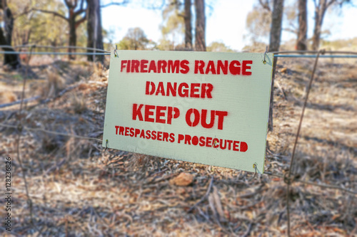 Danger, Firearms Range, Keep Out, Trespassers Prosecuted sign on photo