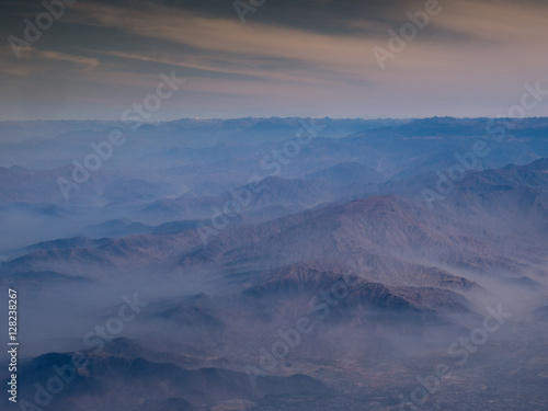 Aerial view from window plane of Andes mountains.
