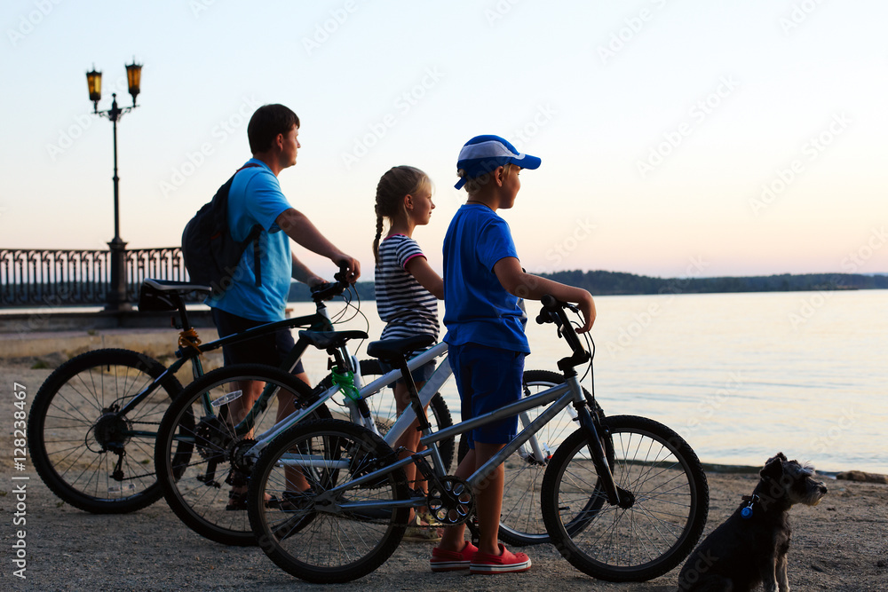Biker family silhouette. Happy family - father with two kids on