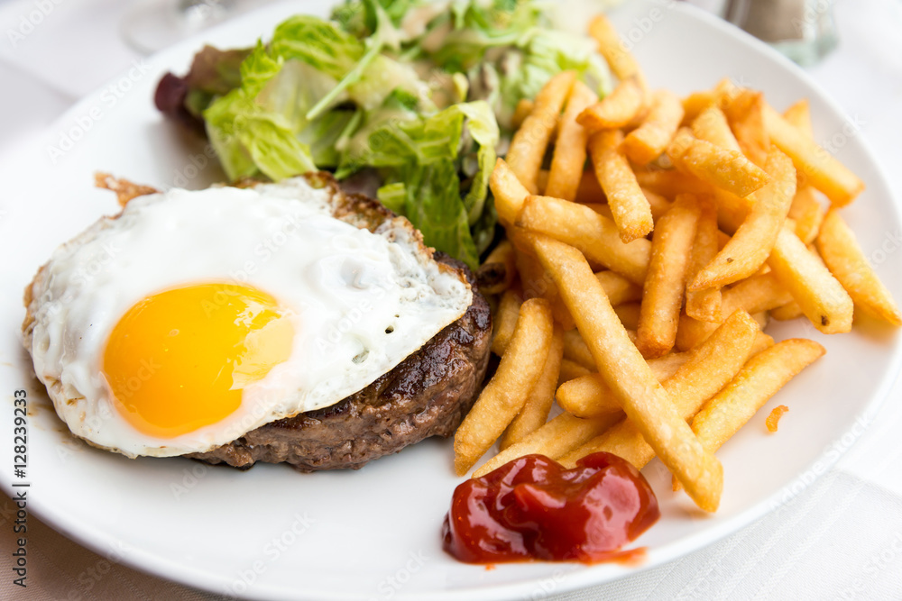 Egg and fries - classical english breakfast with egg and fries Egg and fries - classical english breakfast with egg and fries