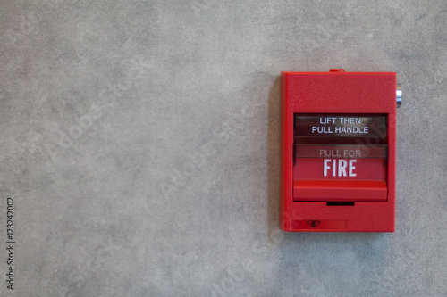 Fire Alarm. Red fire alarm system on grey wall