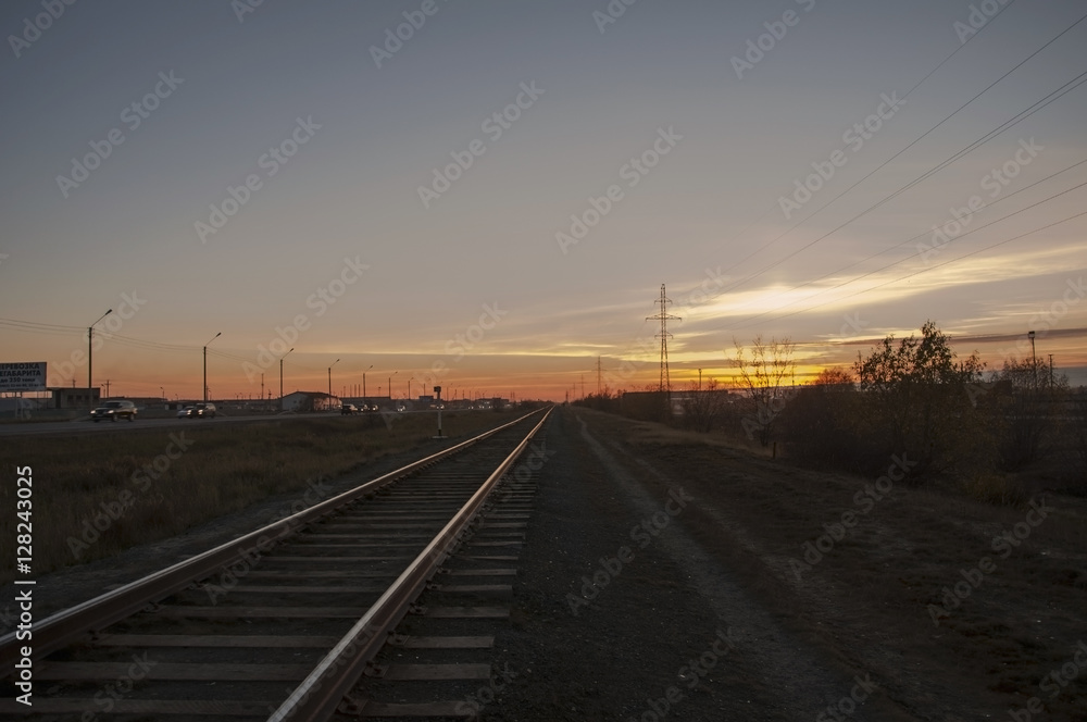 Railroad in the summer evening. Sundown. North