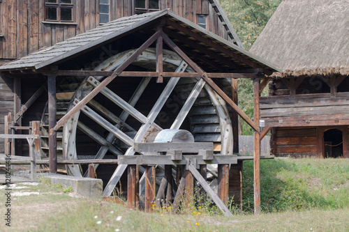 Old vintage watermill in village