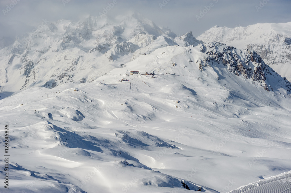 Obraz premium Alpine winter mountain landscape. French Alps with snow.