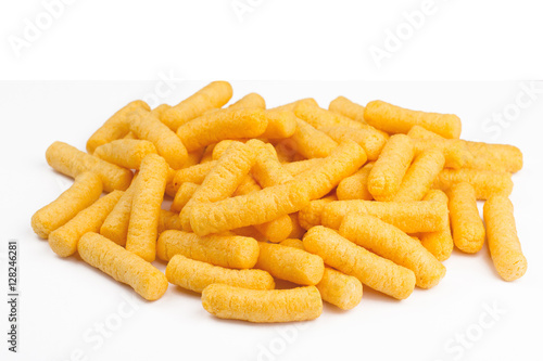 side view of corn puff snacks pile isolated on white