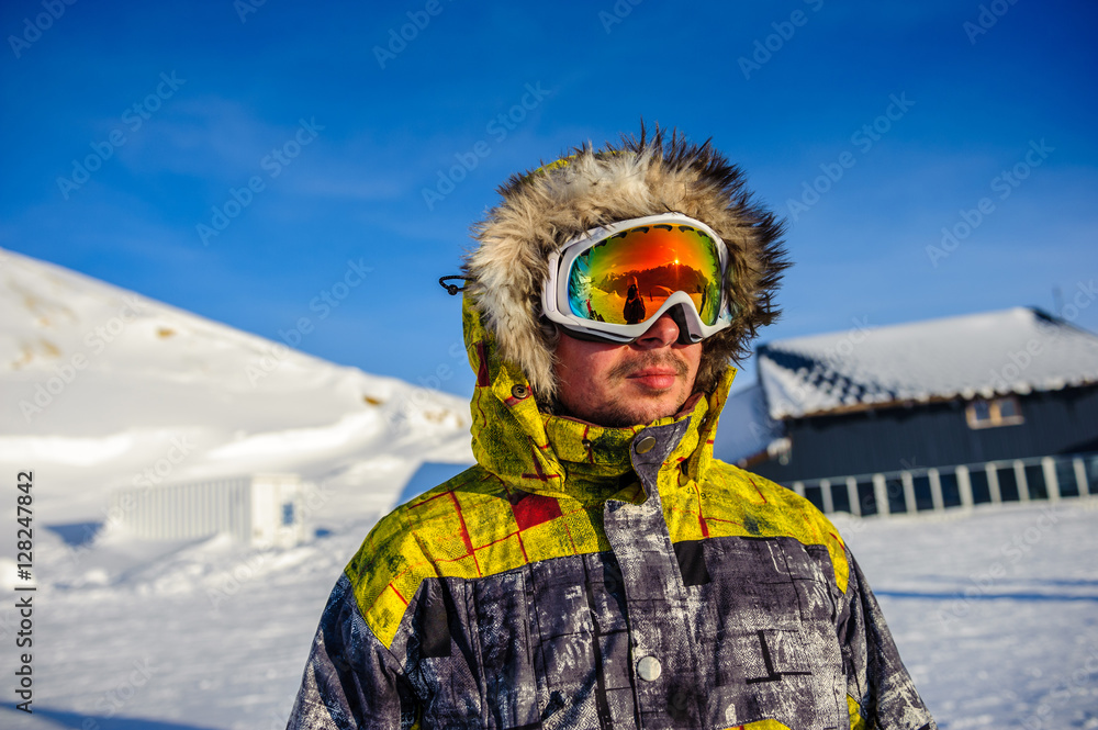 Young man in ski goggles outdoors