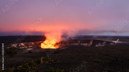 Fiery glow of the lava lake of Kilauea's active crater of Halemaumau at nightfall, view from the Jaggar museum at Volcanoes National Park, Big Island, Hawaii. photo