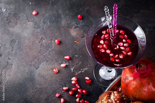 pomegranate cocktail and ripe red pomegranate fruit