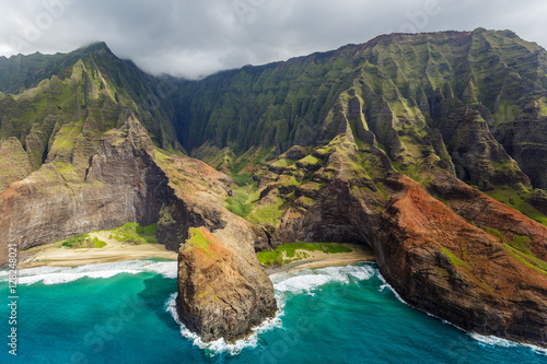Obraz na plátně View of the monumental Na Pali Coast at Honopu Valley and Kalepa Ridge, aerial shot from a helicopter, Kauai, Hawaii
