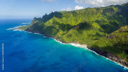 Aerial view on Na Pali Coast with Hanakapiai Beach, Kauai, Hawaii. Kee Beach is in the background. Kalalau trail is visible if zoomed in. Aerial shot from a helicopter.