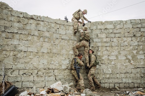 rangers team climbing from a wall
