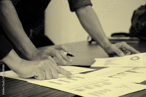Image of male hand pointing at business document during discussi