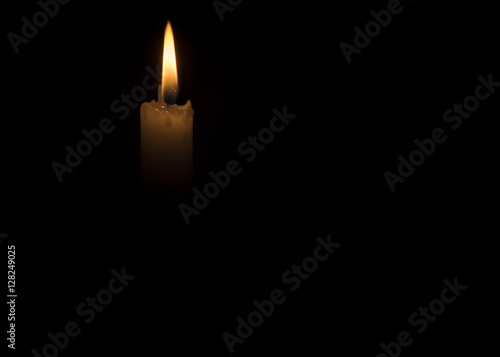 Candle flame on black background