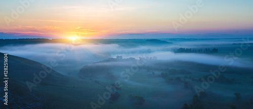Fototapeta Naklejka Na Ścianę i Meble -  landscape of dense fog in the field at sunrise