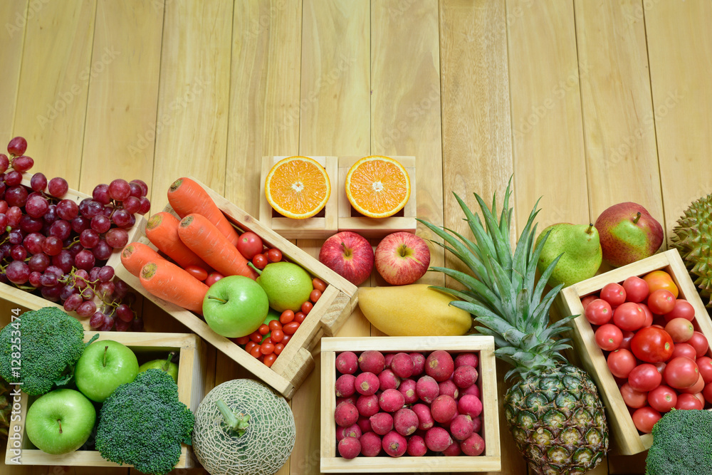 Variouse fresh fruits and vegetables in wooden container with copy space, Top view shooting image Variouse fresh fruits and vegetables in wooden container with copy space, Top view shooting image