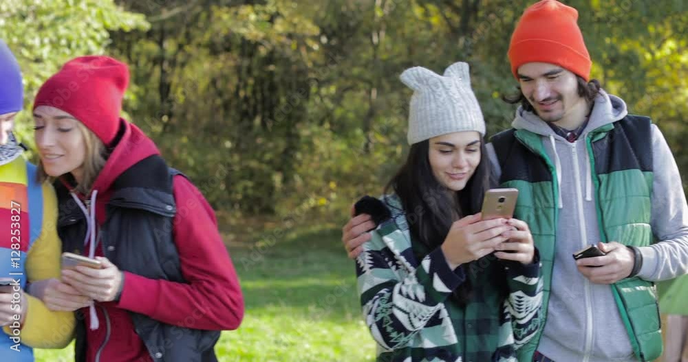 Young People Group Using Cell Smart Phones Messaging, Camping Tent In Forest, Friends Autumn Picnic Slow Motion 60 Young People Group Using Cell Smart Phones Messaging, Camping Tent In Forest, Friends Autumn Picnic Slow Motion 60