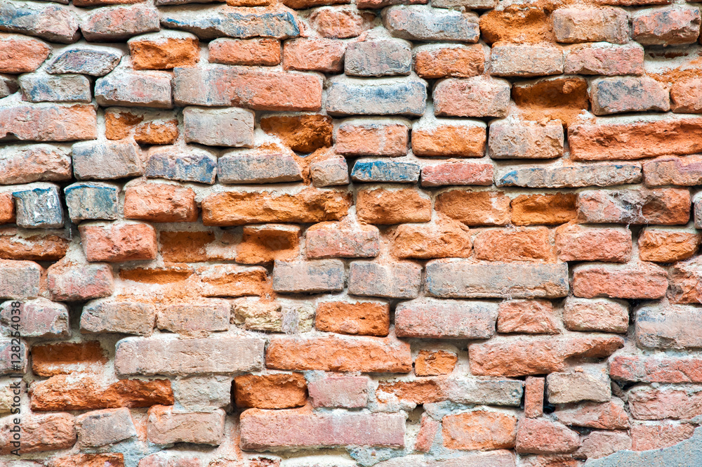 Fototapeta premium Section of an old red brick wall with its texture