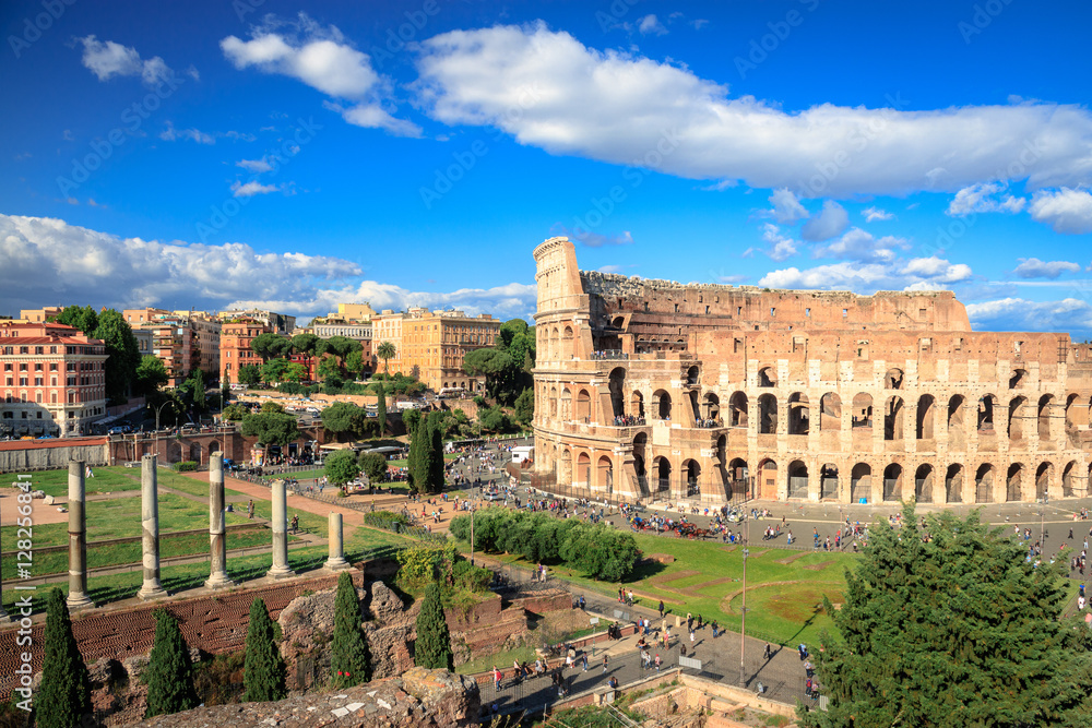 Colosseum with clear blue sky and clouds, Rome