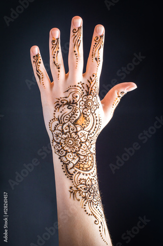mehendi on hands on a black background