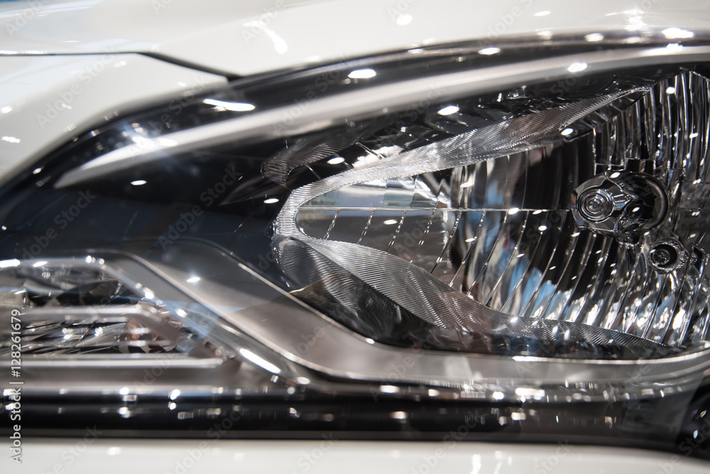 Fototapeta premium Close-up headlights of car