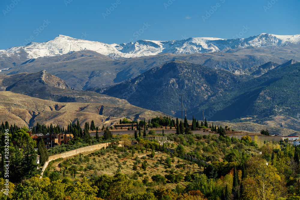 Mediterranean landscape and snowy mountains in the background 