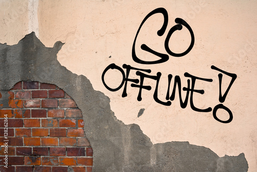 Fényképezés Go Offline - handwritten graffiti sprayed on the wall - danger of excessive social networking, reading emails, etc