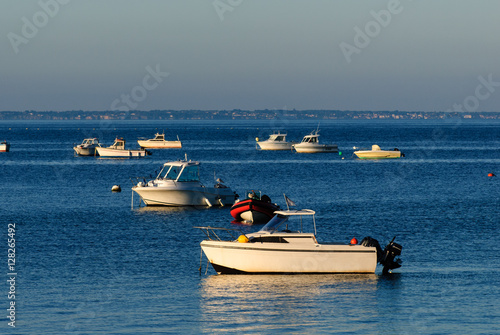 boats parked on water in the morning waiting for their owner to part with them on the seq © fotografiemahieu