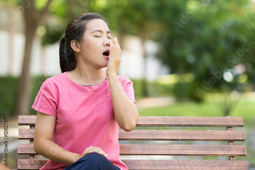 Woman yawning at garden