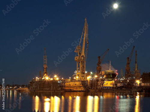 Dry dock in the moonlight at the shipyard in Gdansk, Poland.