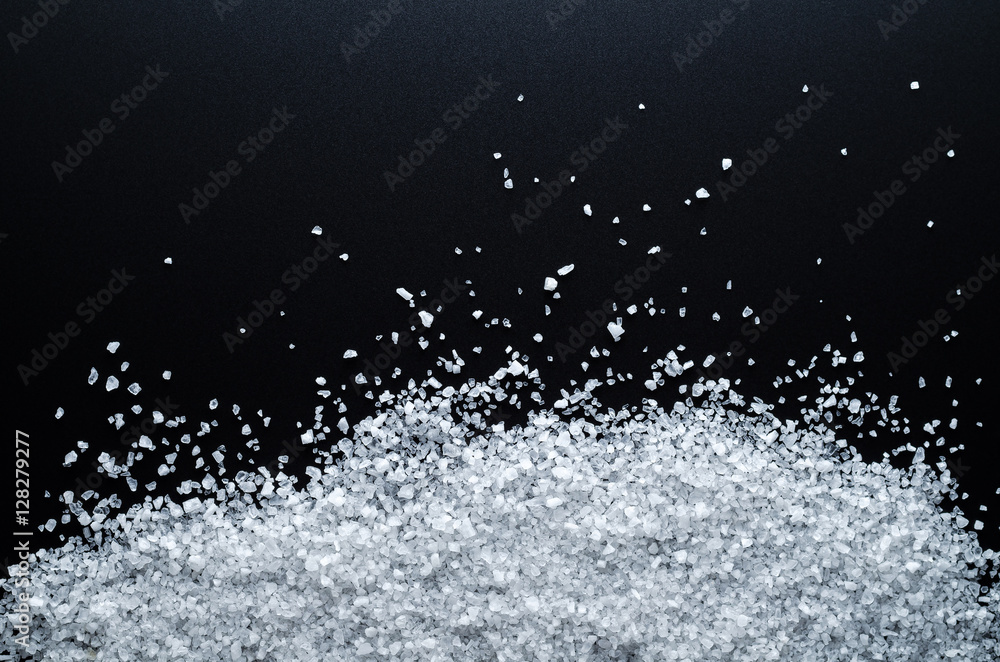 Large Sea Salt (As Snow) On A Black Background. Close-Up. Top View.