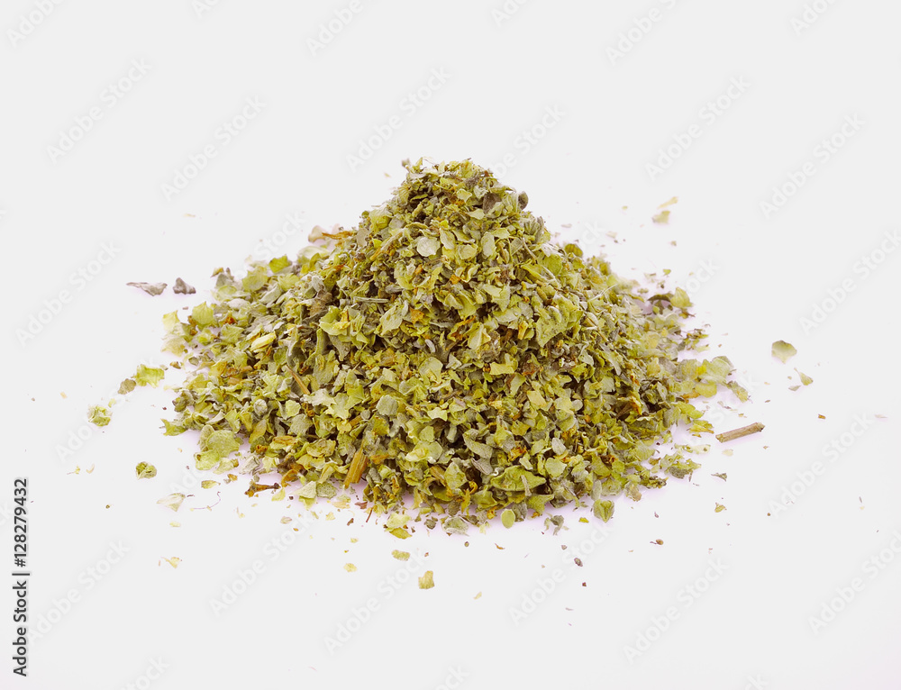 Spilled dried majoram heap isolated on white background Spilled dried majoram heap isolated on white background