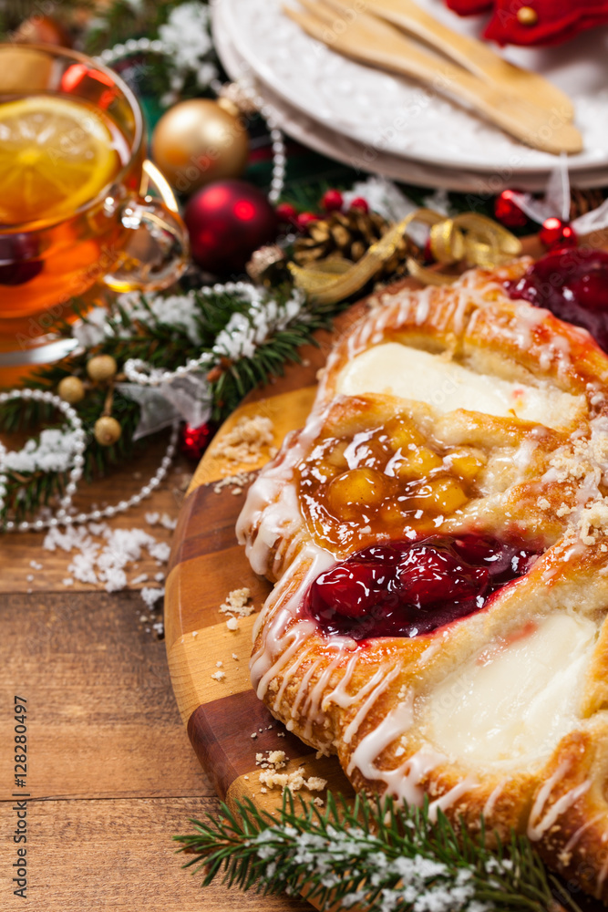 Christmas Background Baking Dessert. Danish Pastry Ring with Cherry, Apple fruit and Cheese fillings. Selective focus.