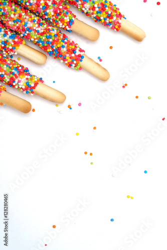 Colorful biscuit stick coated enamel rainbow sugar with white space for writing wording