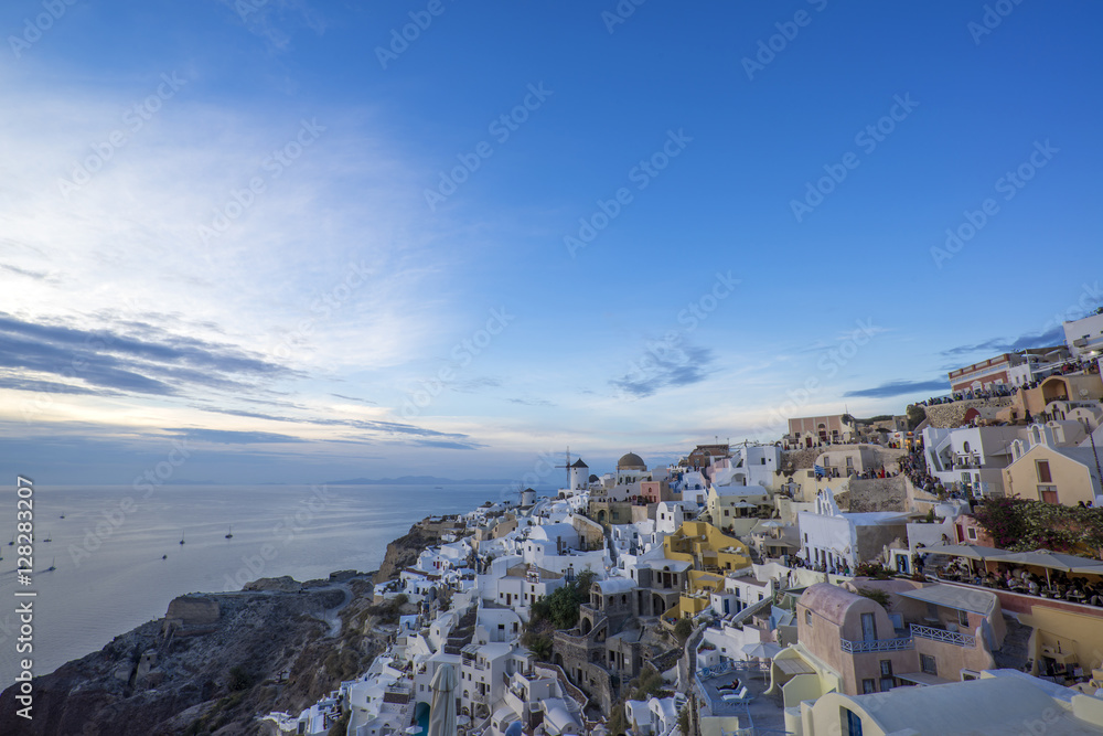 cityscape of Oia, traditional greek village of Santorini at sunset, Greece