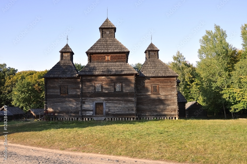 History. Ancient  wood Christianity church in the summer meadow