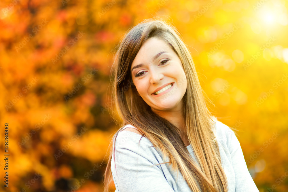 Young woman in an autumnal environment Young woman in an autumnal environment